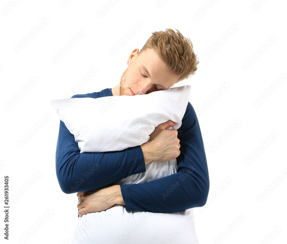 Sleepy man with pillow on white background