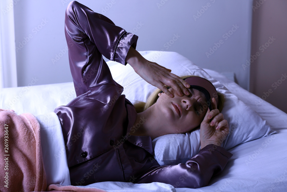 Woman suffering from insomnia at night