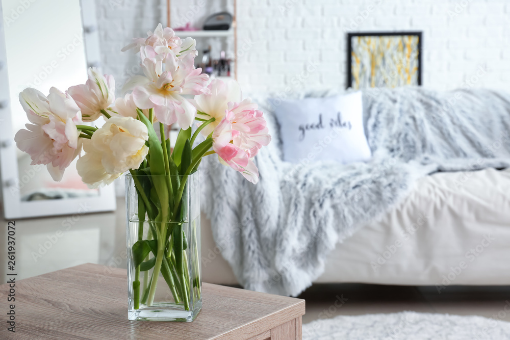 Bouquet of beautiful tulips on table in room