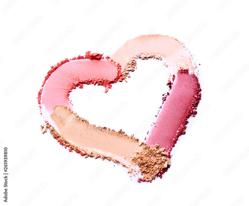 Heart shape made of cosmetic powder on white background