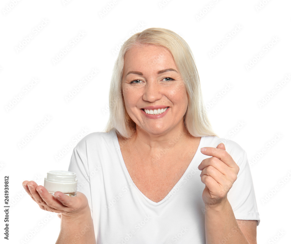 Mature woman with jar of cream on white background