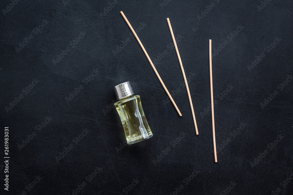 floral fragrance diffuser for air freshness on dark background top view mock-up