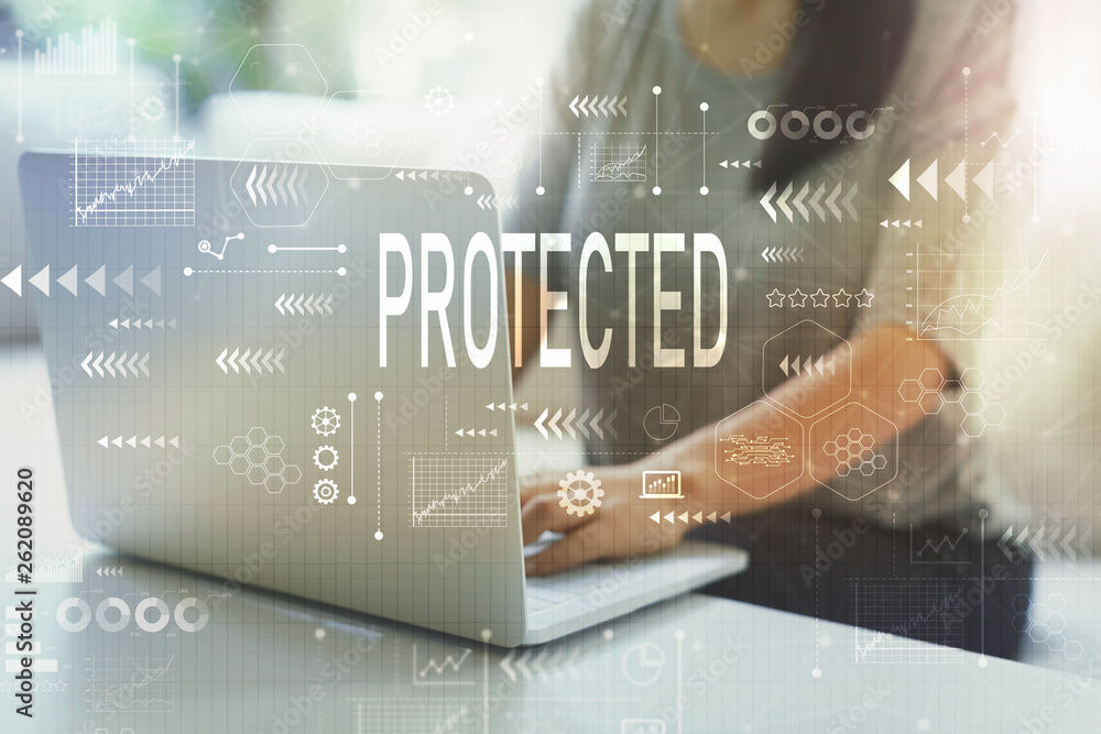 Protected with woman using her laptop in her home office