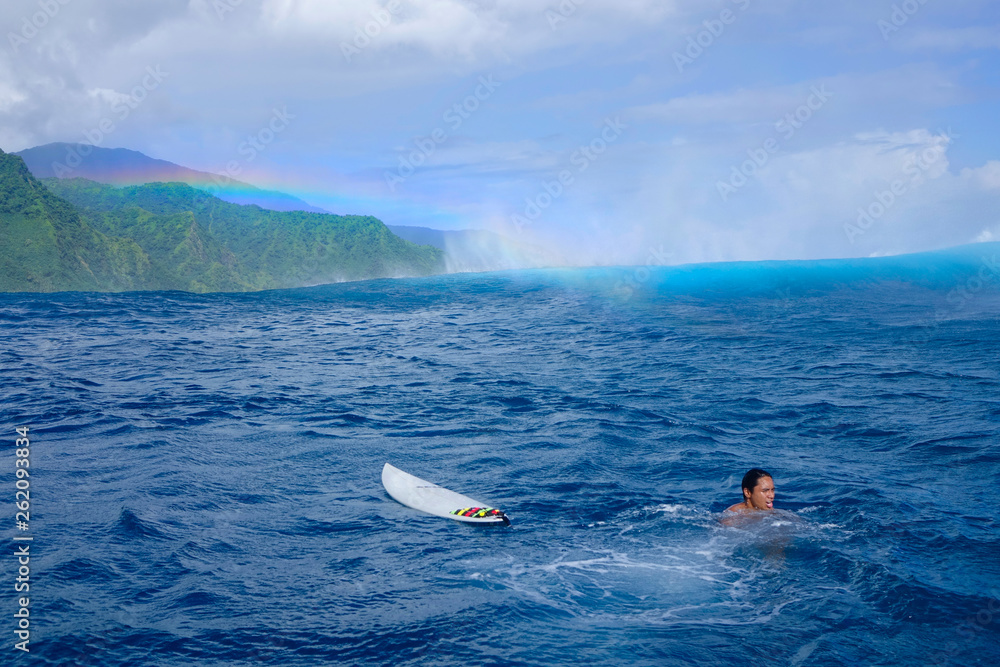 AERIAL: Teahupoo wave approaching the young local surfer in French Polynesia.