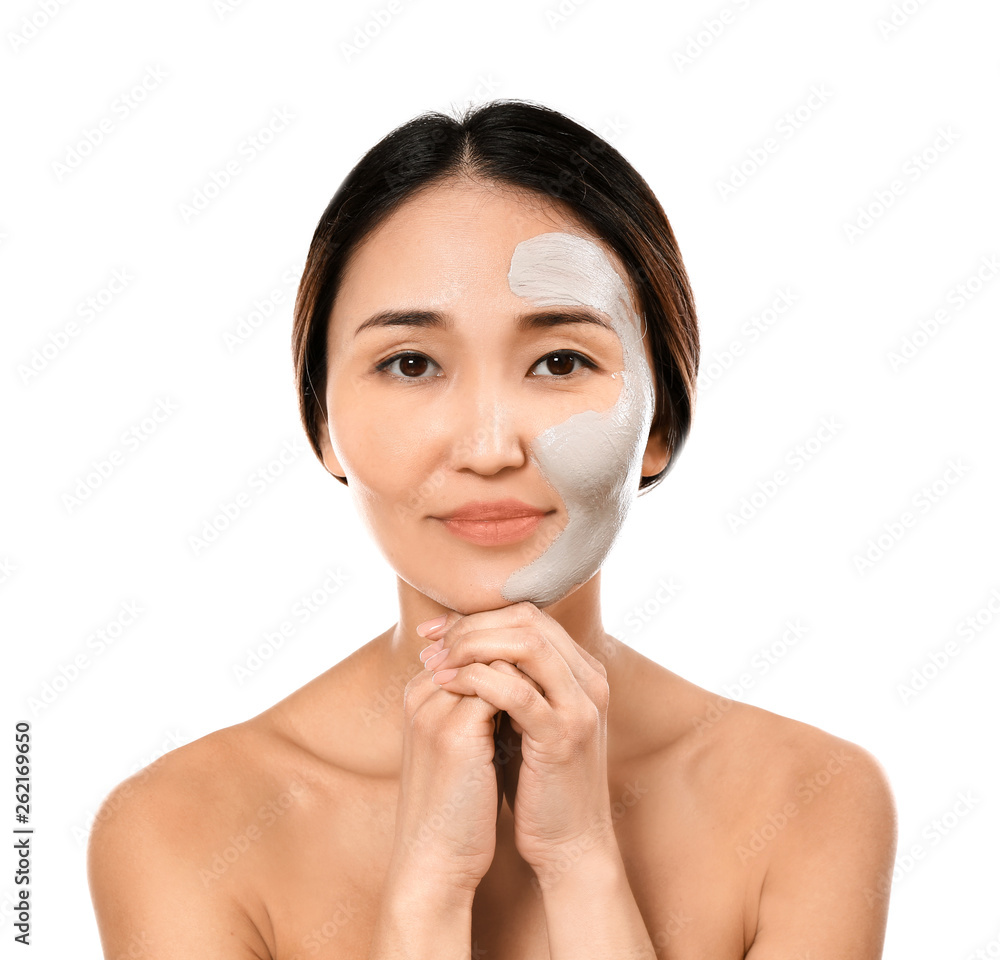 Asian woman with facial mask on white background