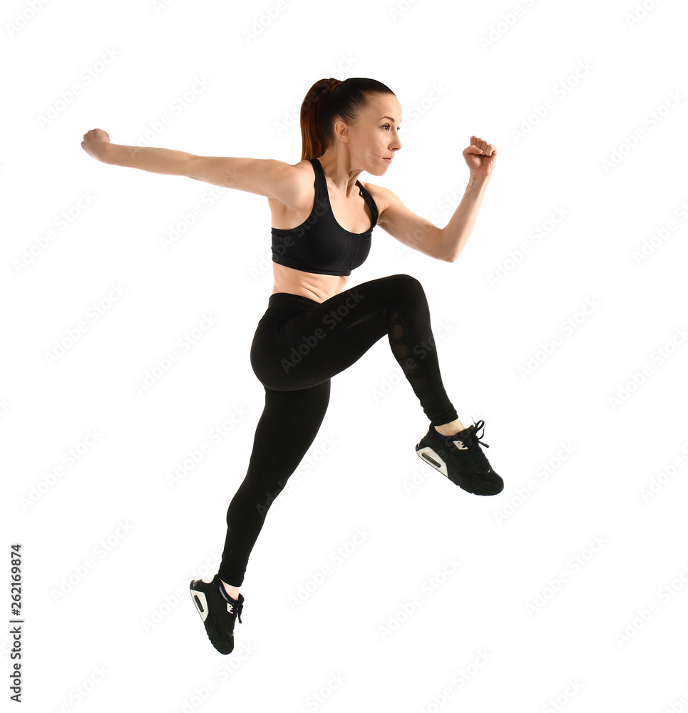 Sporty jumping woman on white background