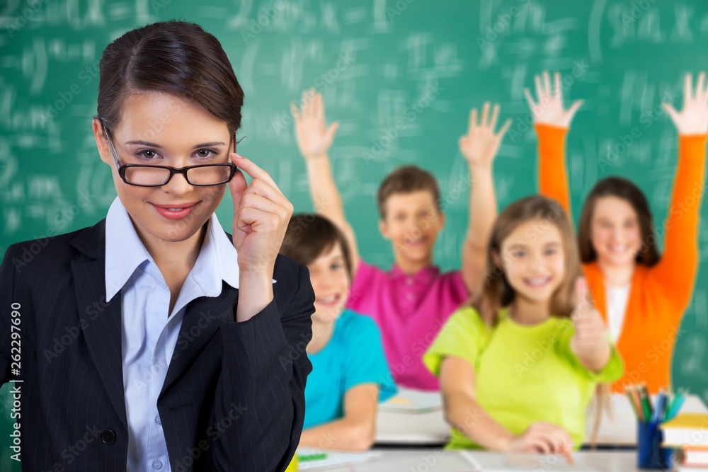 Female teacher with children at class on background