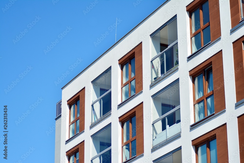 Modern apartment buildings on a sunny day with a blue sky. Facade of a modern apartment building