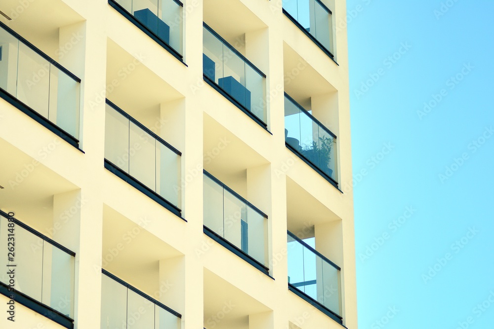 Modern apartment buildings on a sunny day with a blue sky. Facade of a modern apartment building