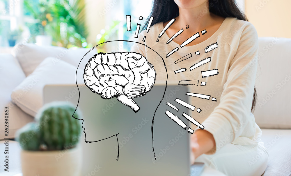 Brain illustration with woman using her laptop in her home office