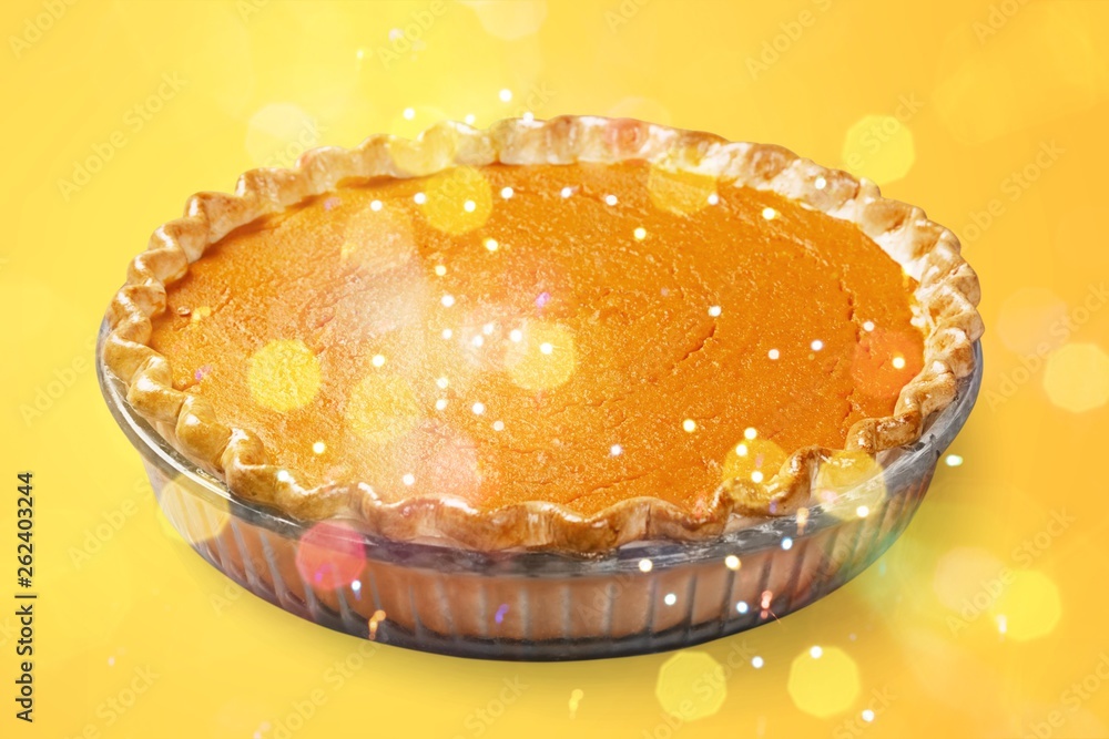 Home made pumpkin pie on white background.