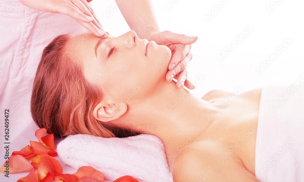 Beautiful young woman relaxing with  massage at beauty spa