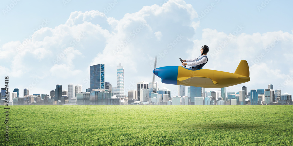 Businessman in aviator hat and goggles