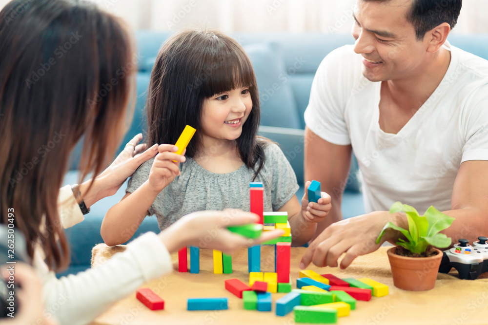 happy family caucasian and asian mixed race with pretty daughter enjoy family time with toy  togethe