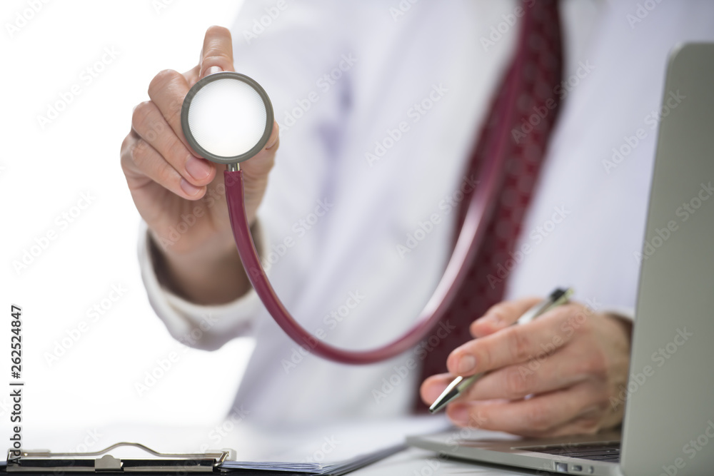 Medical doctor holding stethoscope in hospital setting