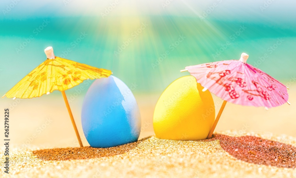 Colorful easter eggs on ocean beach