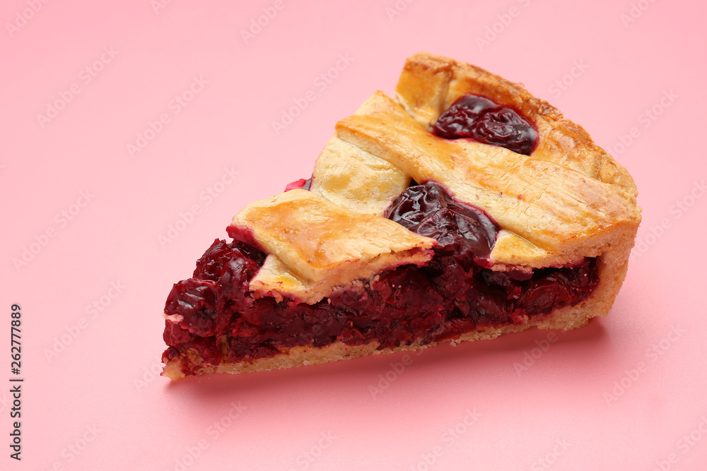 Piece of tasty cherry pie on color background