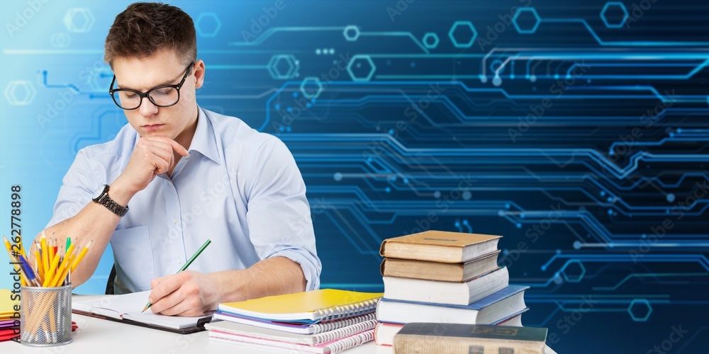 Handsome Teenager boy studying over  background