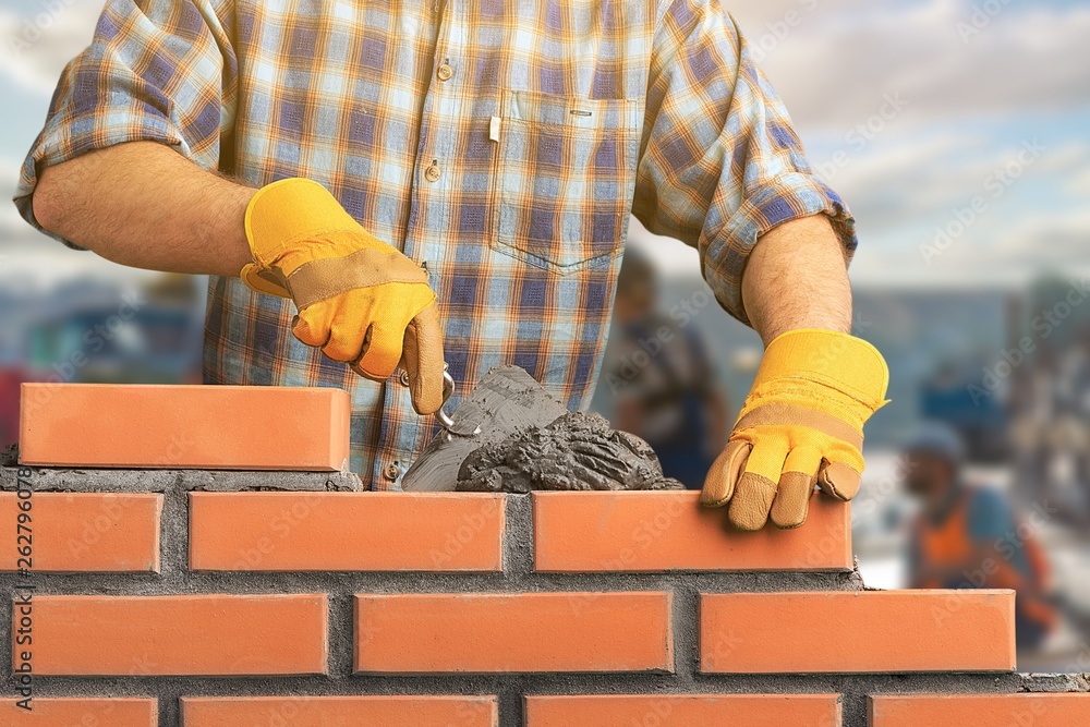 Portrait of young profession man at work on background