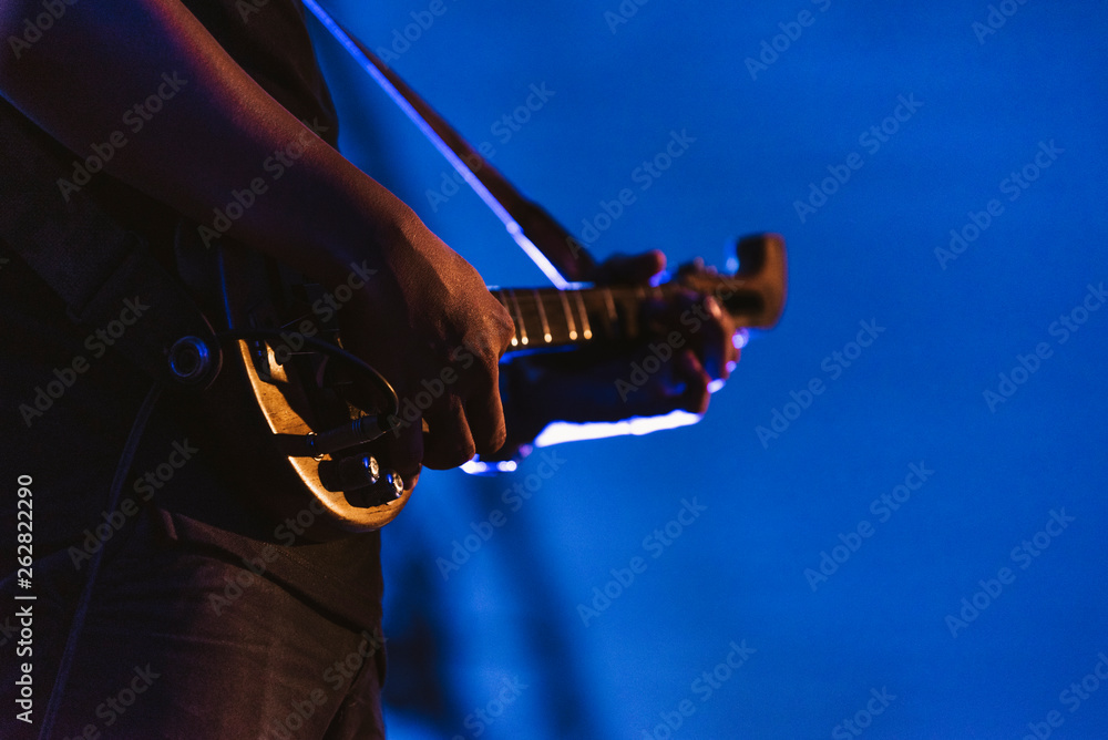 Guitarist on stage for background, soft and blur concept