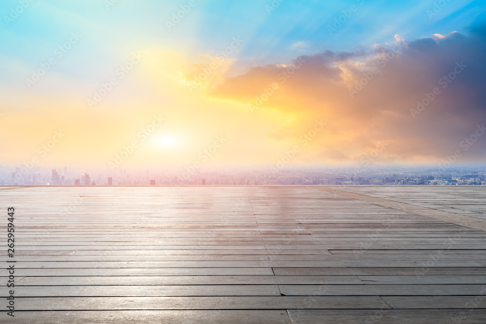 Shanghai city skyline and wooden platform with beautiful clouds scenery at sunset