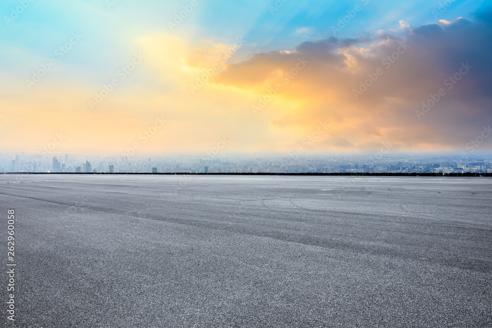 Shanghai city skyline and asphalt race track ground scenery at sunrise