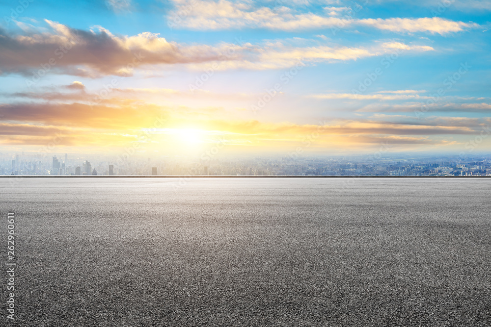 Shanghai city skyline and asphalt race track ground scenery at sunrise