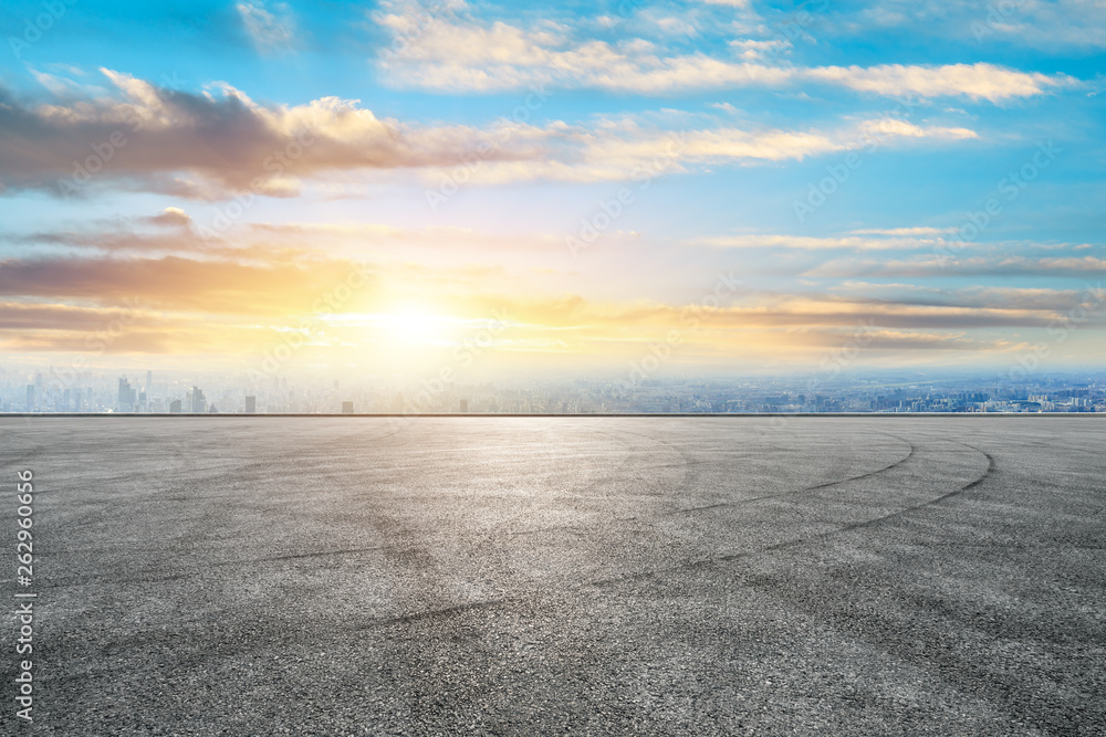 Shanghai city skyline and asphalt race track ground scenery at sunrise