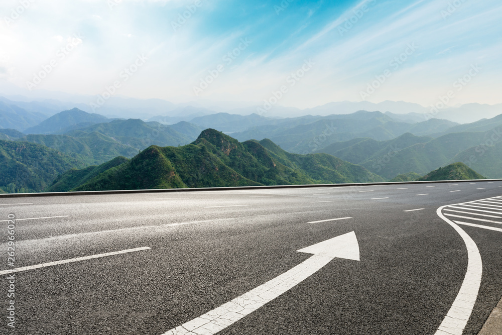 Empty asphalt road and mountains with beautiful clouds landscape