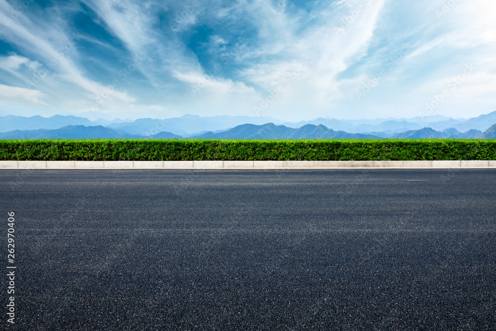 Empty asphalt road and mountains with beautiful clouds landscape