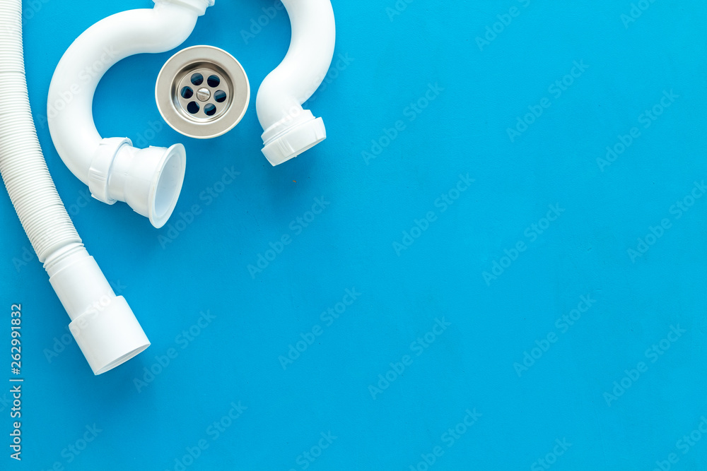 Professional instruments for plumber on blue background top view space for text