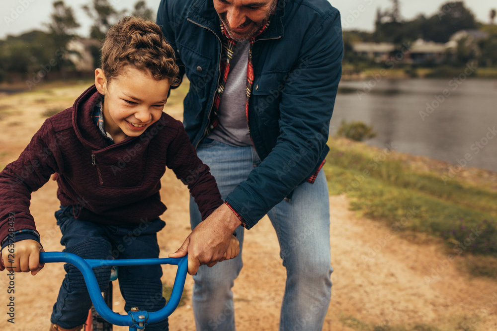 Kid learning to ride a bicycle