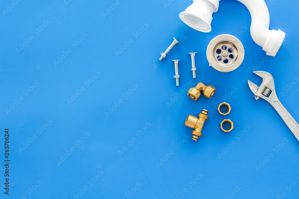 Plumber work with instruments, tools and gear on blue background top view mockup