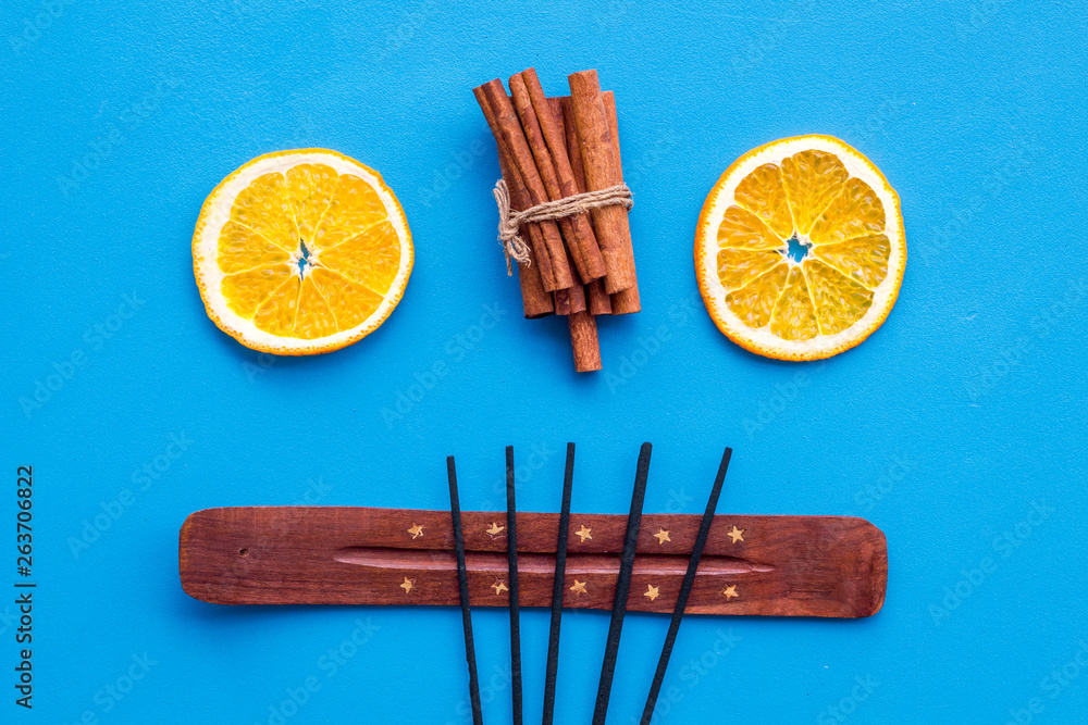 incense sticks with citrus and cinnamon for fresh air on white background top view