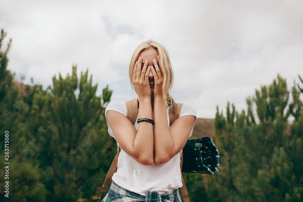 Woman explorer travelling through a forest having fun