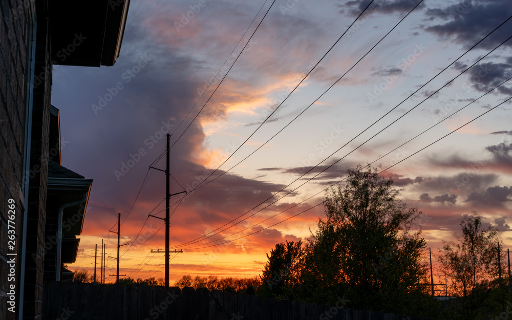 power lines sunset residential area in the city