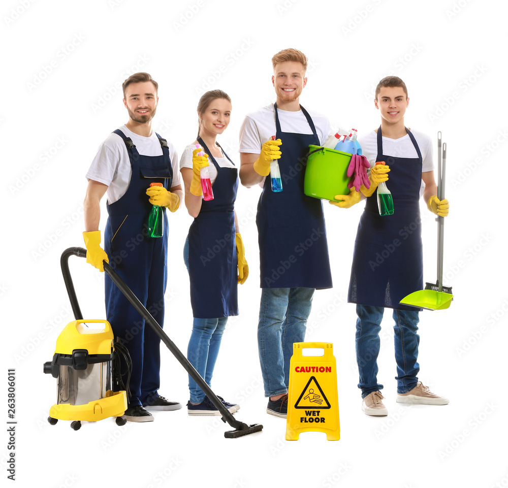 Team of janitors with cleaning supplies on white background