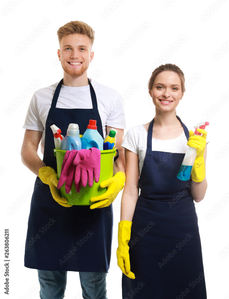 Team of janitors with cleaning supplies on white background