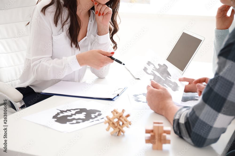 Female psychologist working with couple in office