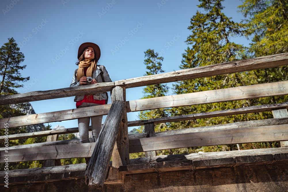 Young woman with a retro camera outdoors