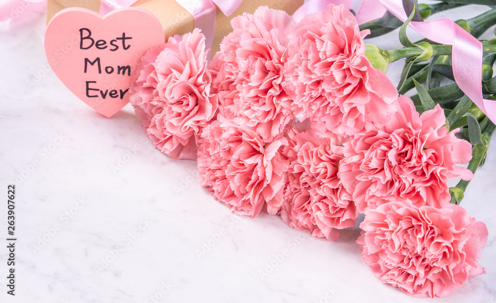 Design concept - Beautiful bunch of carnations on marble white background, top view, copy space, clo