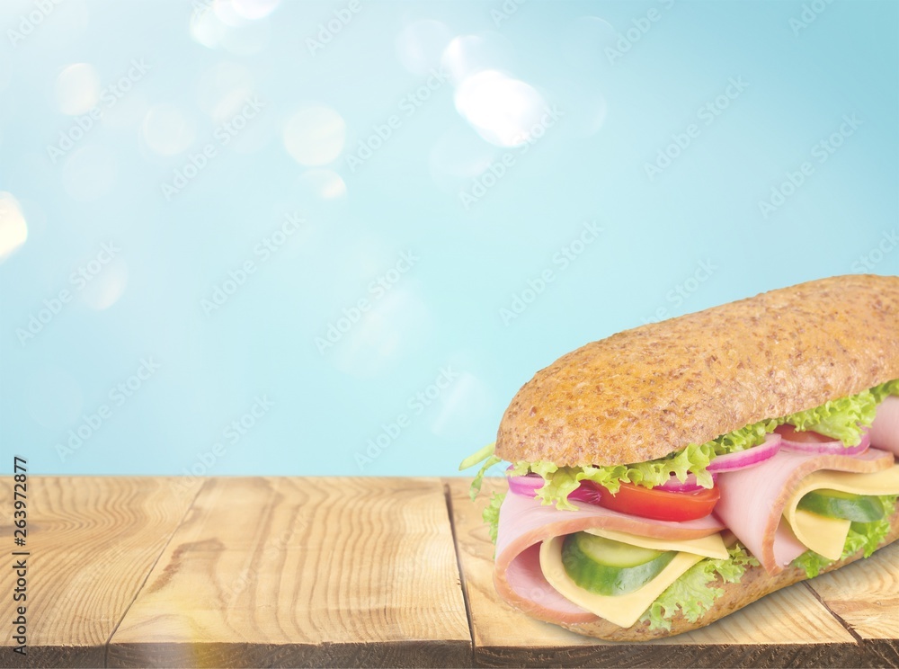 Footlong ham & swiss submarine sandwich isolated on white