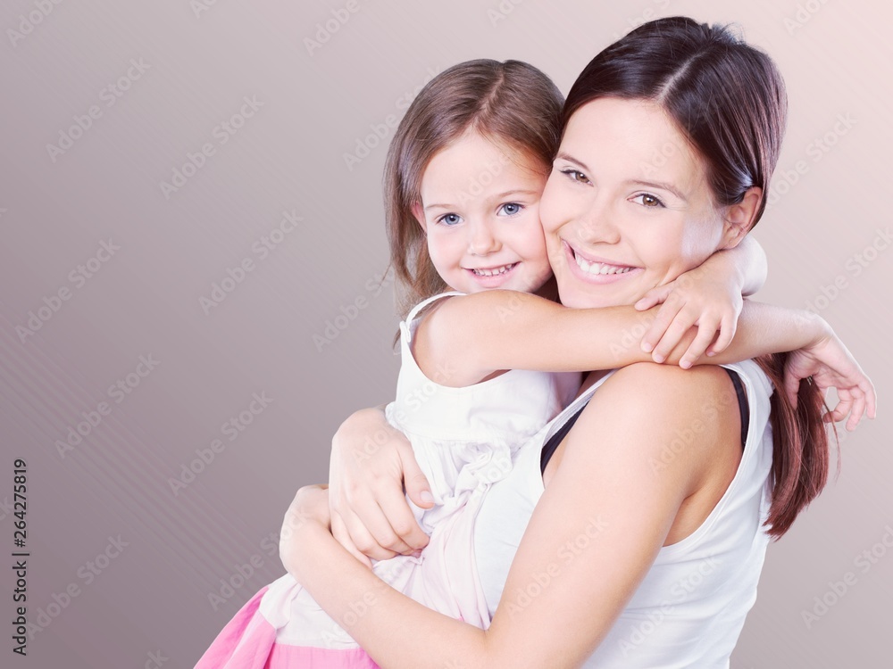 Happy Mother and daughter together with flowers