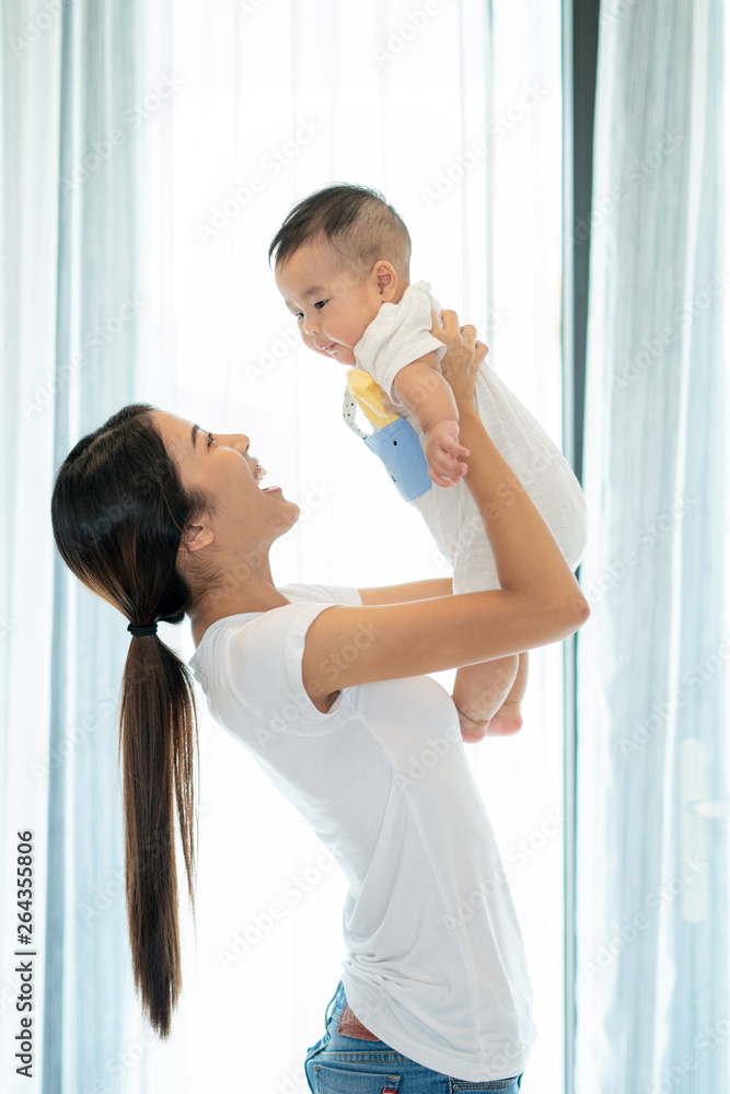 Mother play with her baby