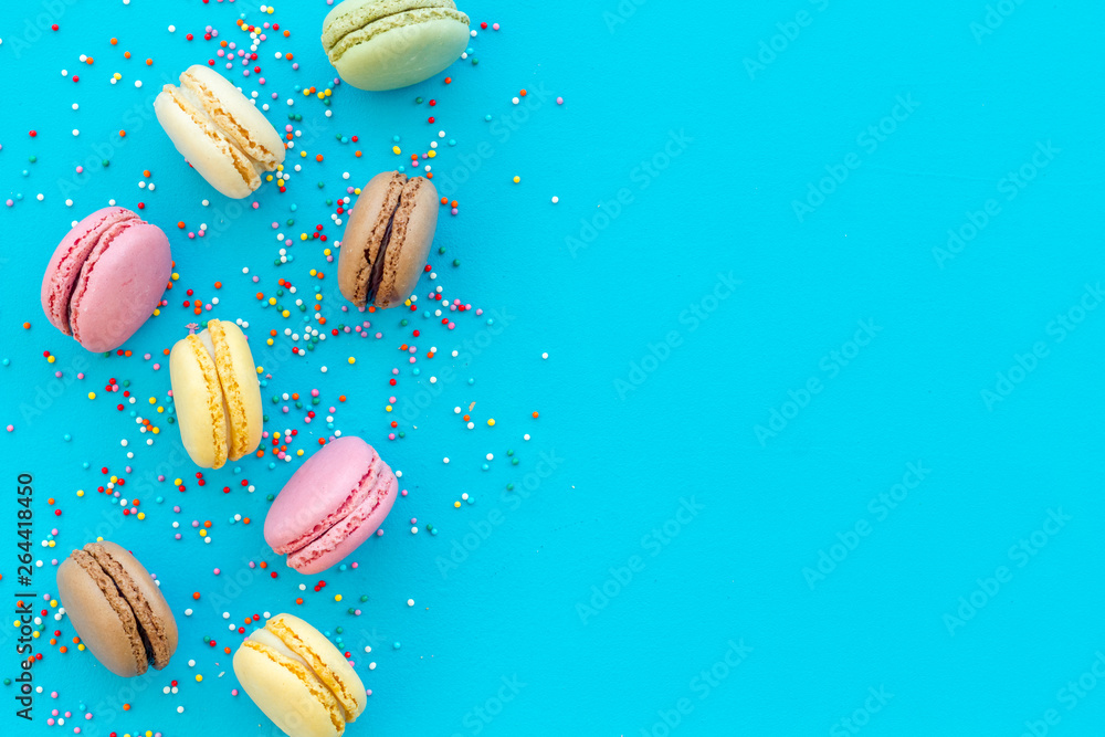 sweet dessert pattern with macarons on blue background flat lay mockup