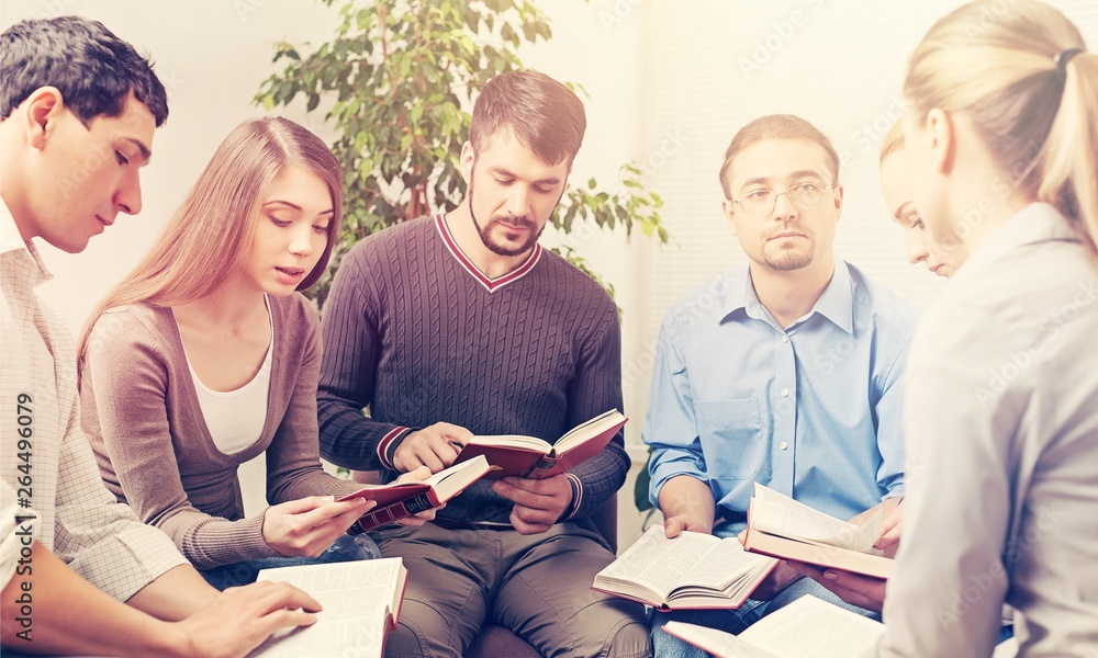 Group of people Reading Bible book Together