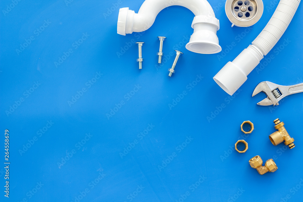 Professional instruments for plumber on blue background top view space for text