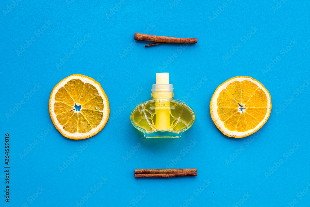 citrus and cinnamon fragrance diffuser for air freshness on blue background top view