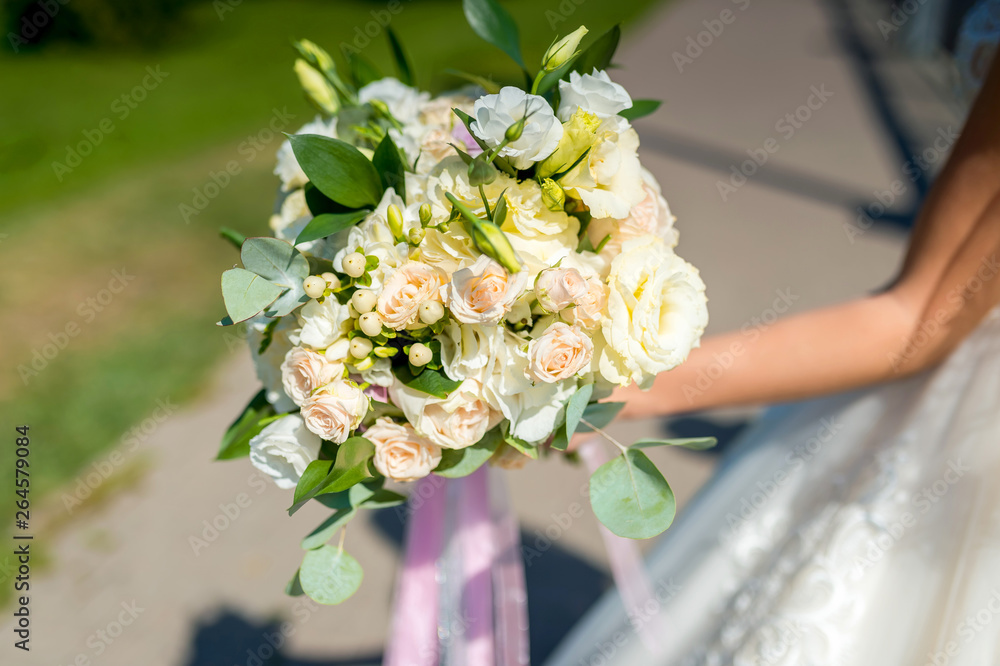 Bride holding flower bouquet