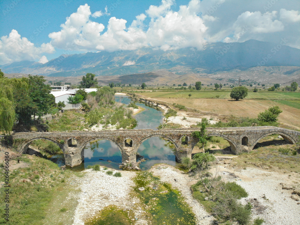 AERIAL: Flying towards the famous Kordhoce bridge crossing a drying up river.